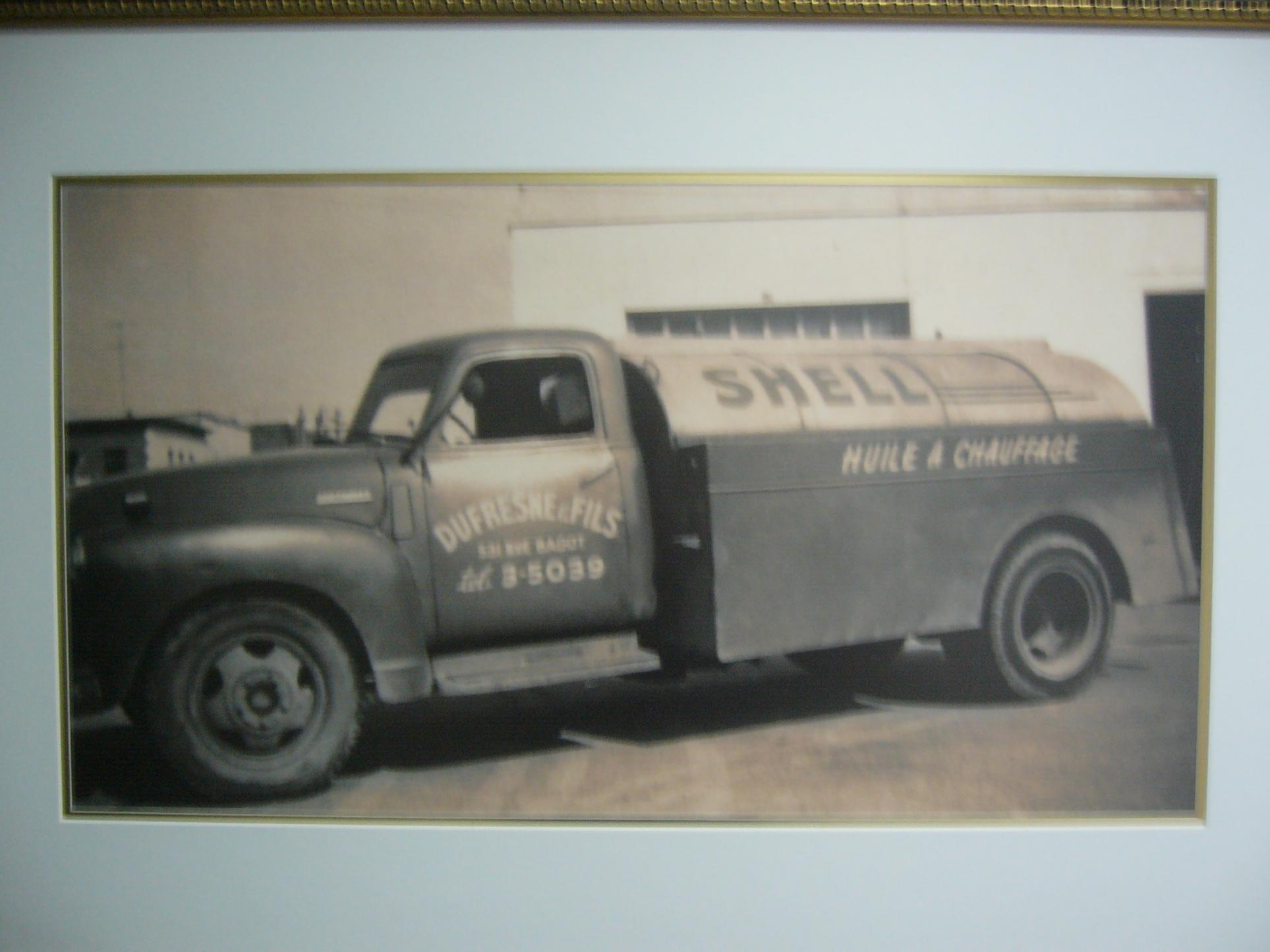 Vintage Shell oil delivery truck photo in frame.