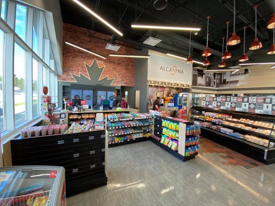 Convenience store with snacks and beverages inside.